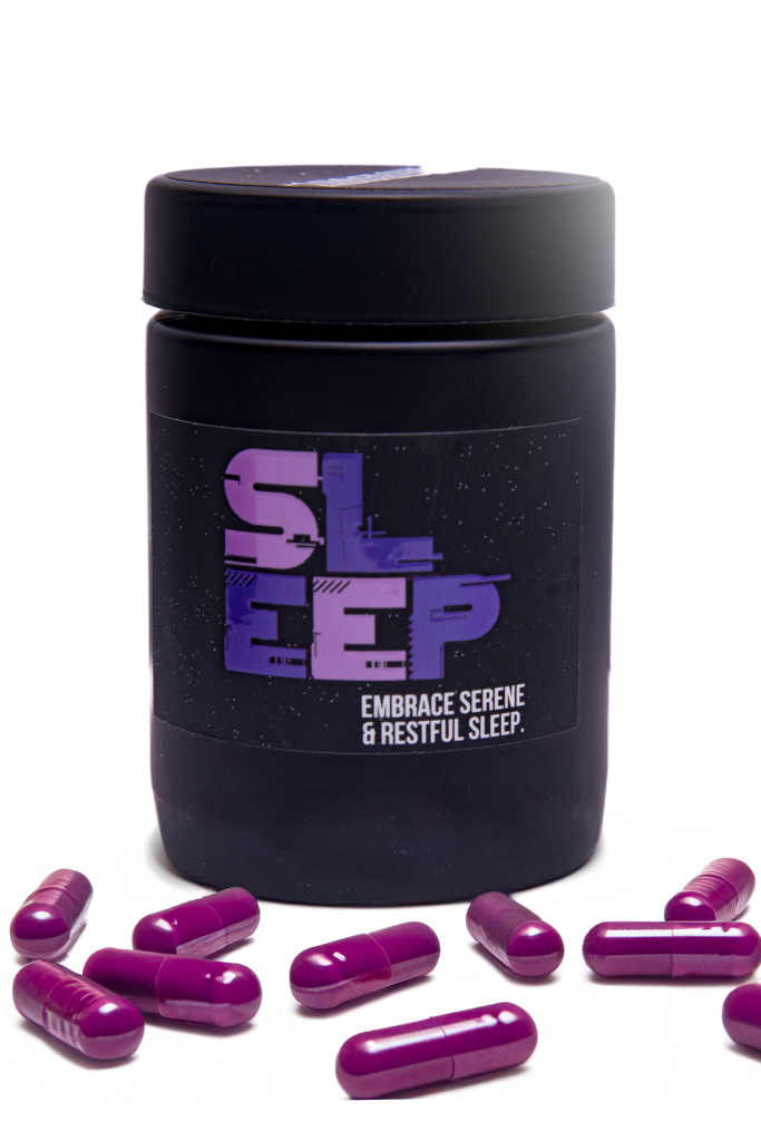 StarDust Sleep Capsule Wellness Supplement in a container with pills beneath it